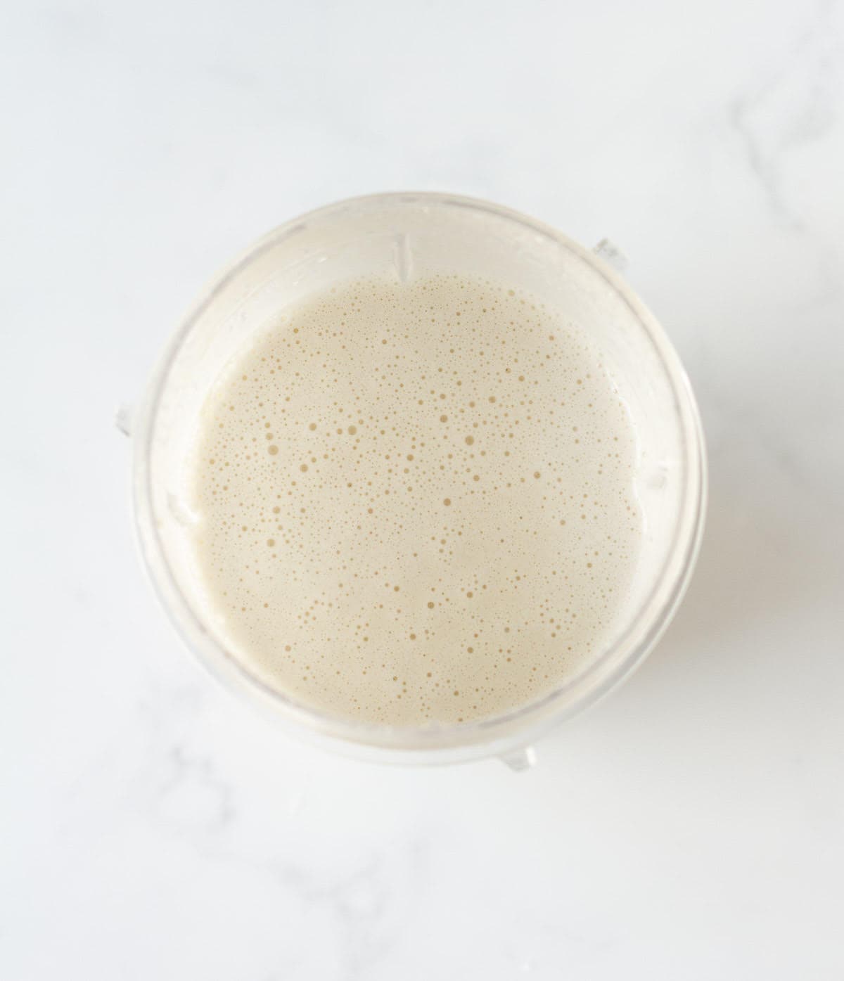 blended cashew milk in a blender jar.