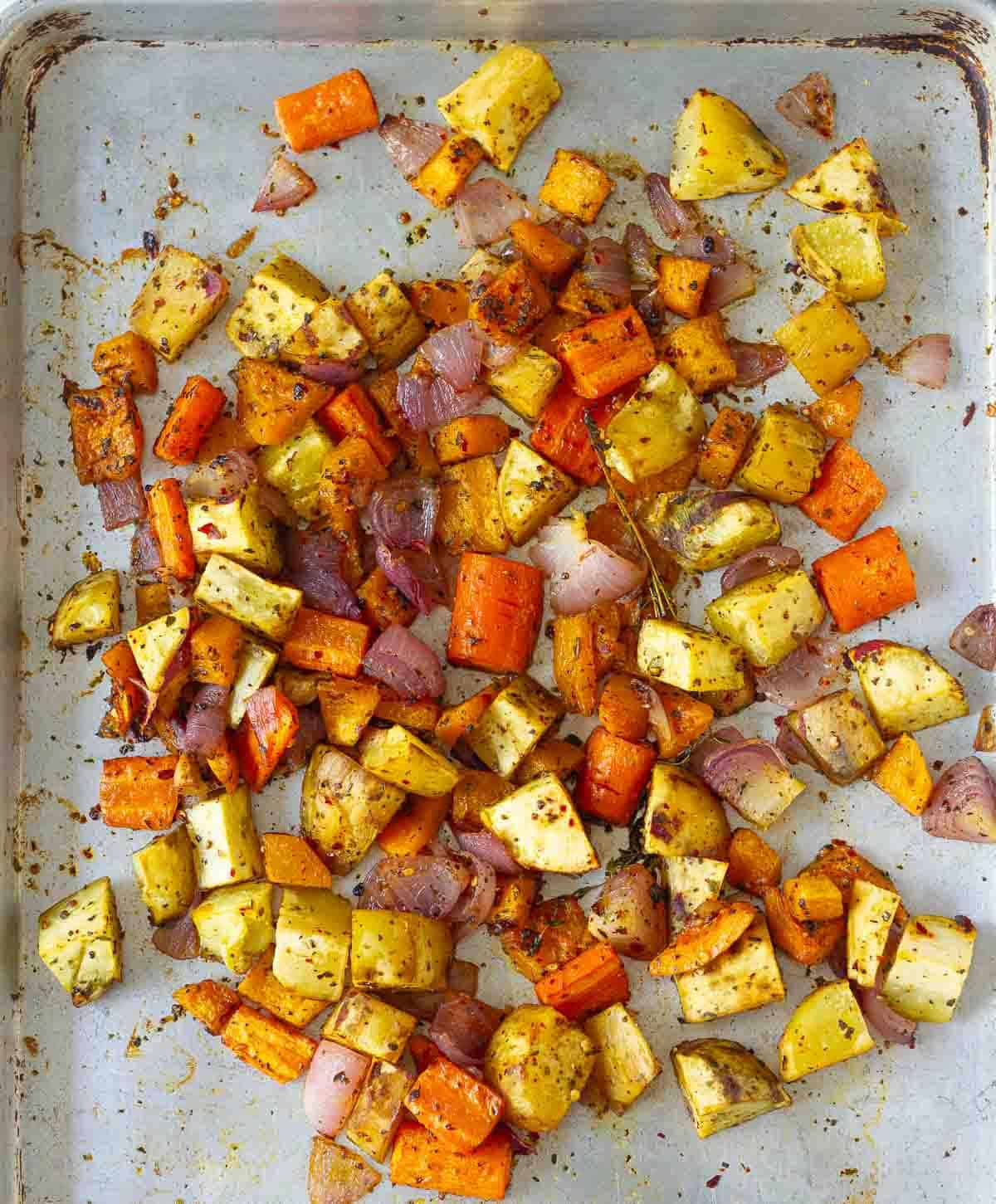 roasted vegetables on a baking tray.
