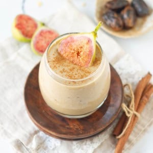 fig smoothie with dates in a glass with sliced fig.