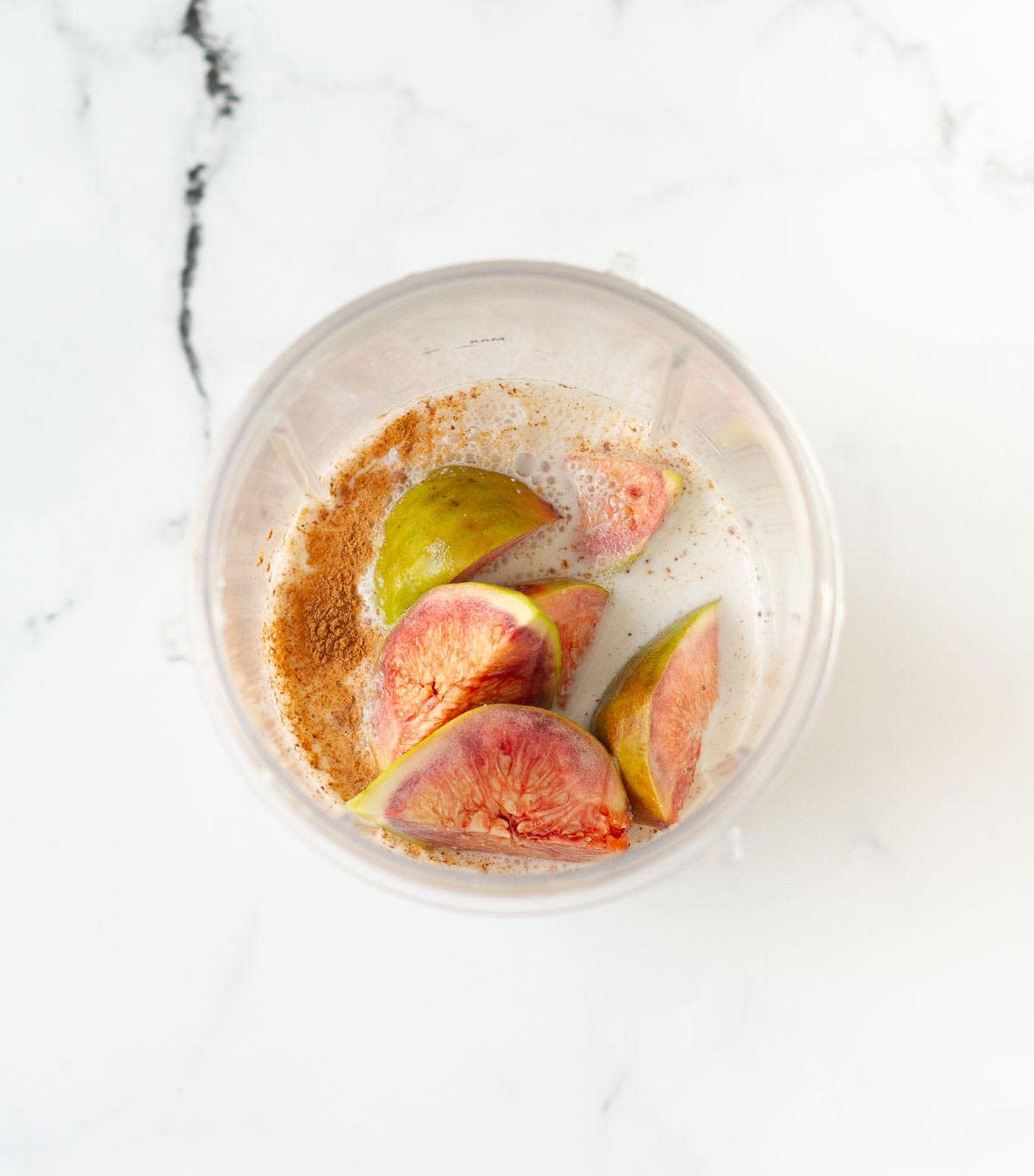 fig smoothie ingredients in a blender jar.
