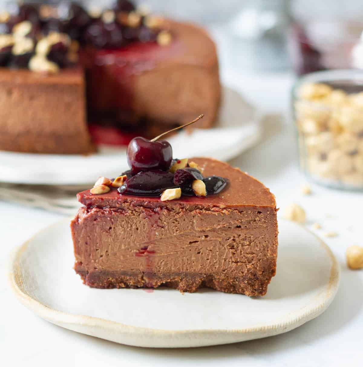 A slice of chocolate cheesecake on a small plate.