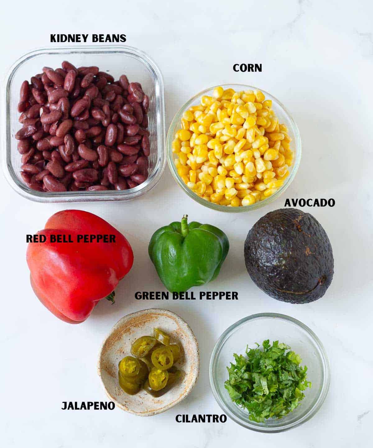 Labelled vegetables for corn avocado bean salad.