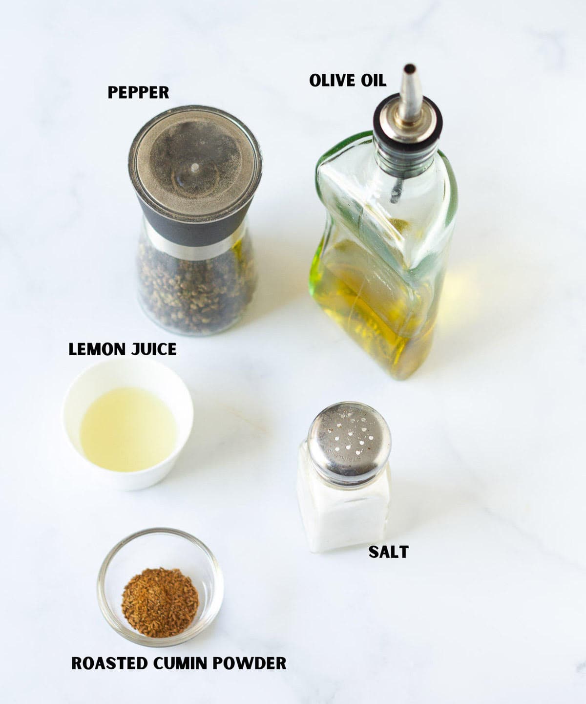 Labelled ingredients for making salad dressing.