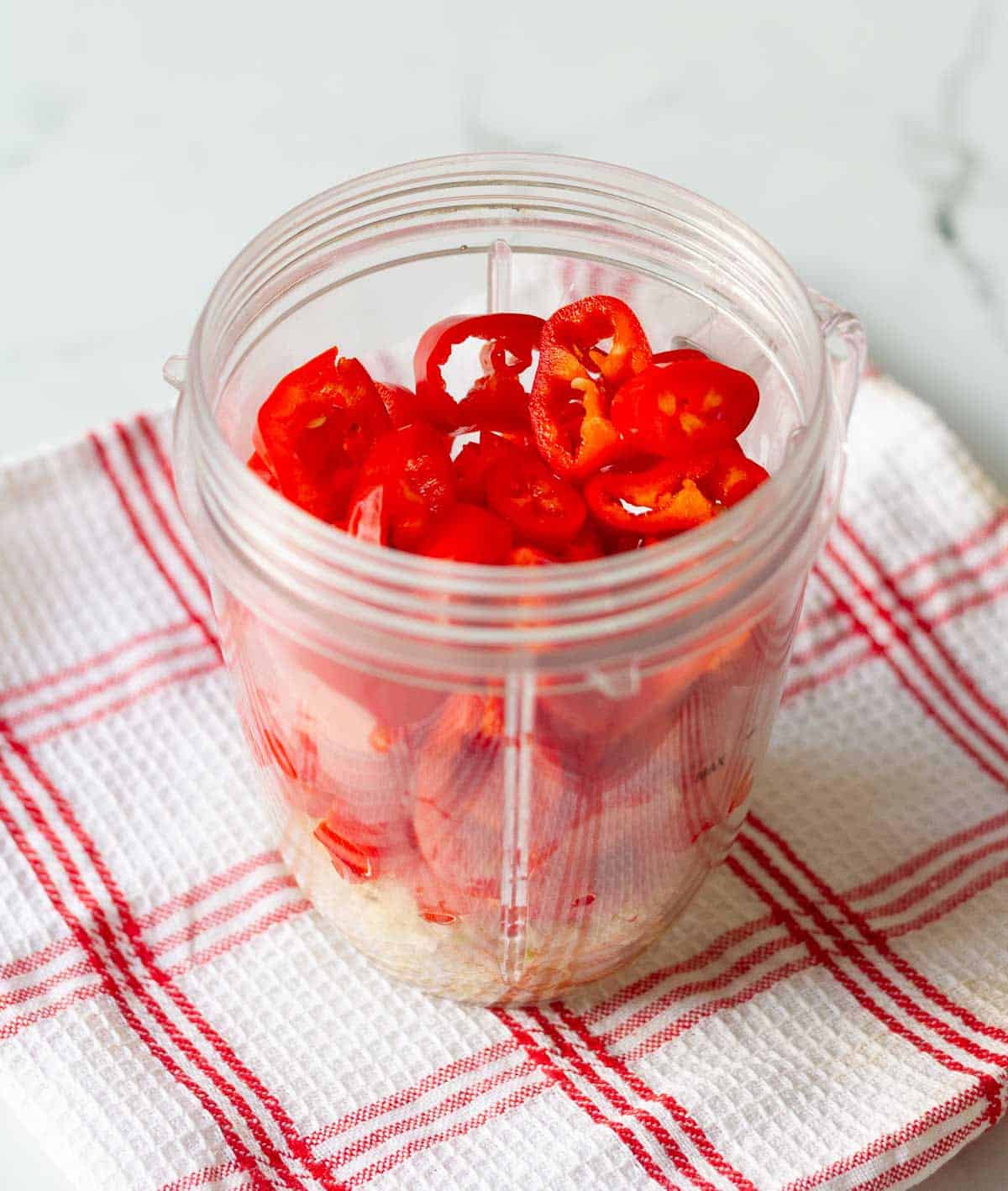 Ingredients for chili sauce in a blender jar.