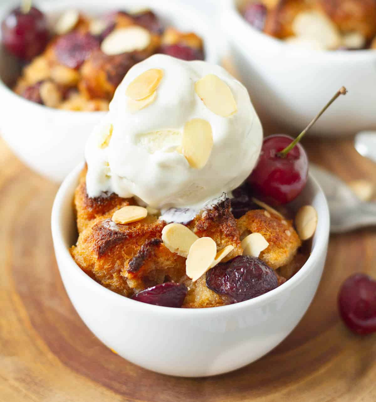 bread pudding with a scoop of vanilla ice cream.