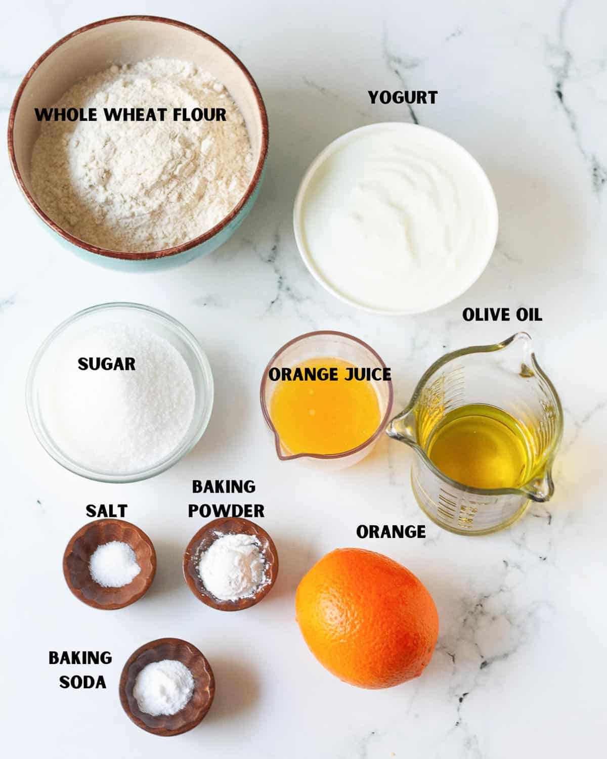 Labelled ingredients for making upside down orange cake.
