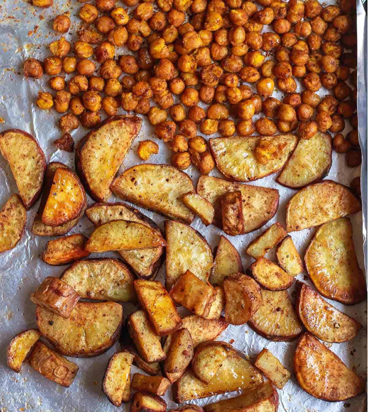 roasted sweet potatoes and chickpeas on a baking tray.