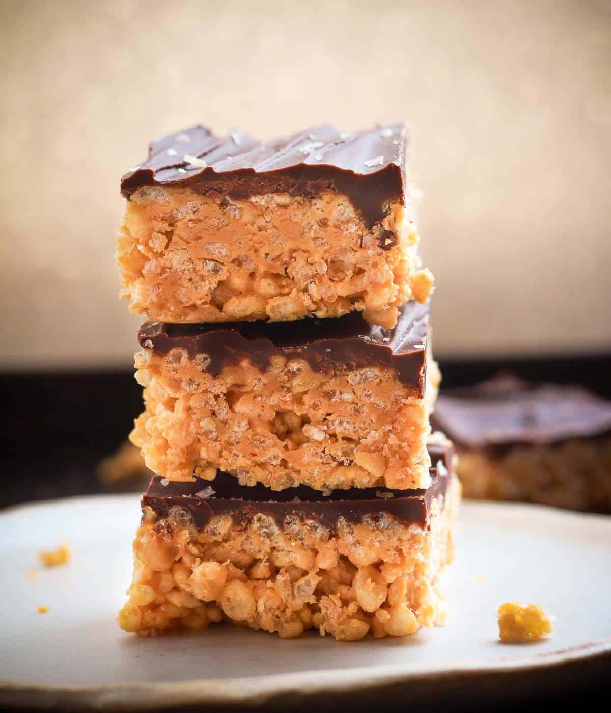 3 pieces of peanut butter Rice Krispie squares stacked on top of each other.
