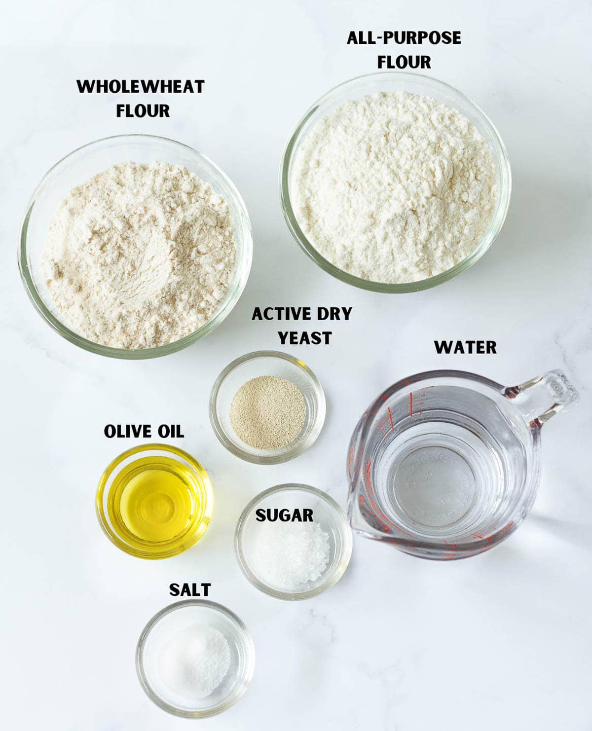 Labelled ingredients for making easy homemade bread.