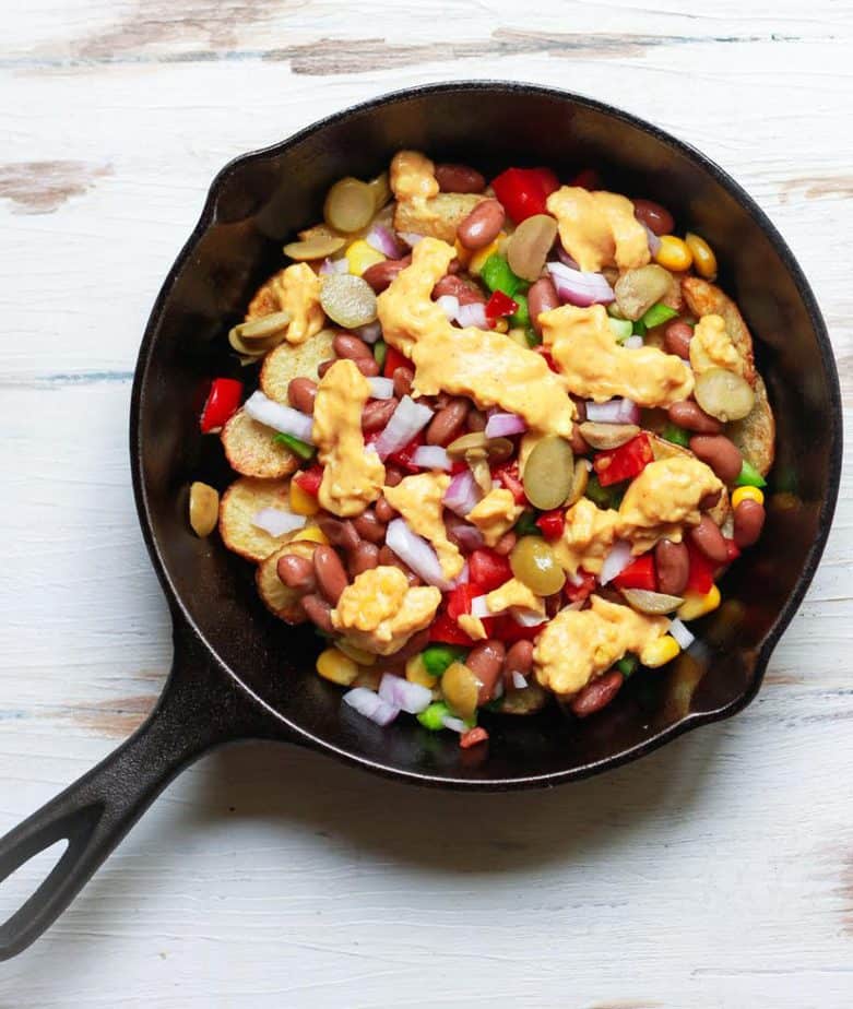 Layering the ingredients for Loaded Potato Nachos | Easy fun kid friendly recipe