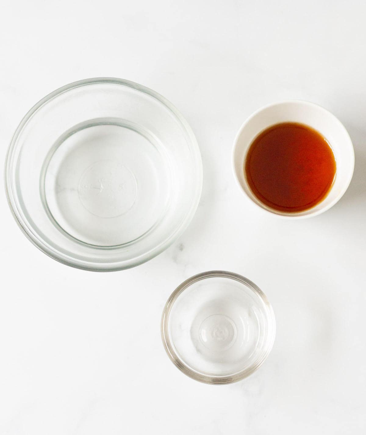 water, honey, and rosewater in small bowls.