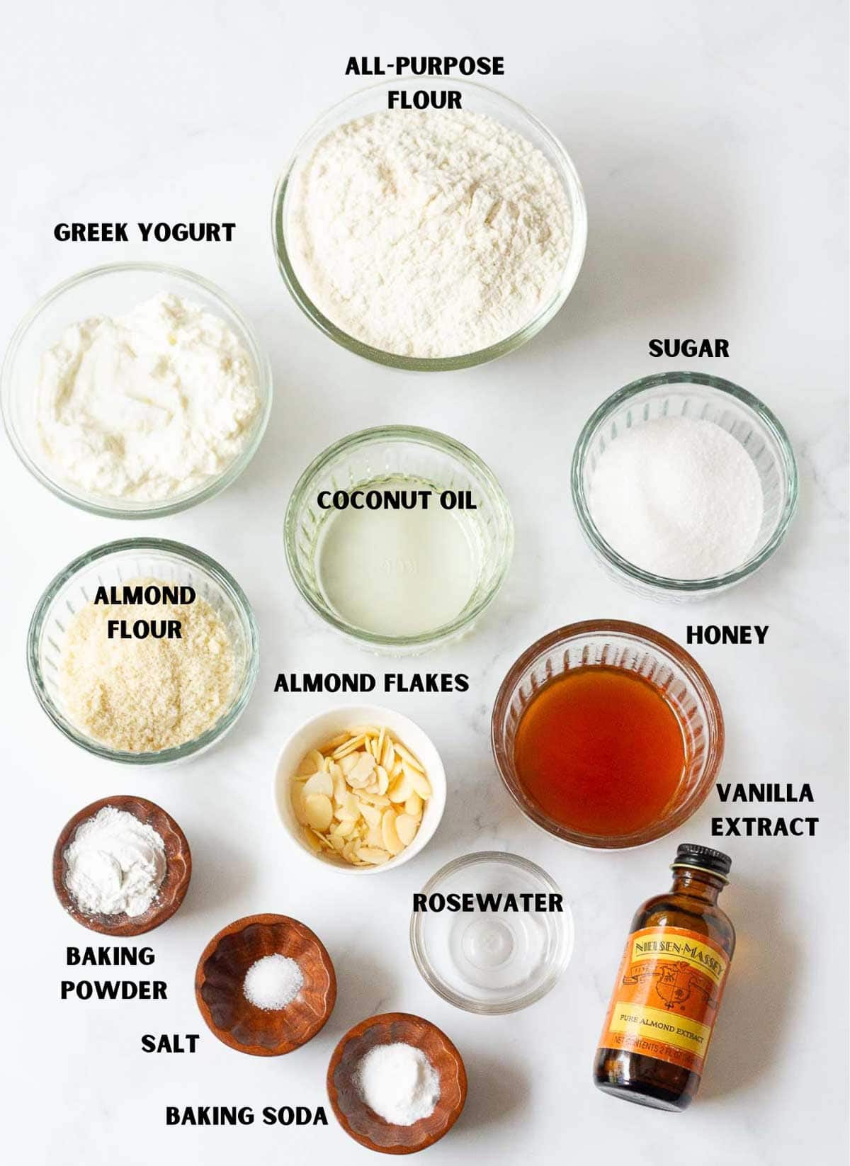 Labelled ingredients for making almond honey cake.