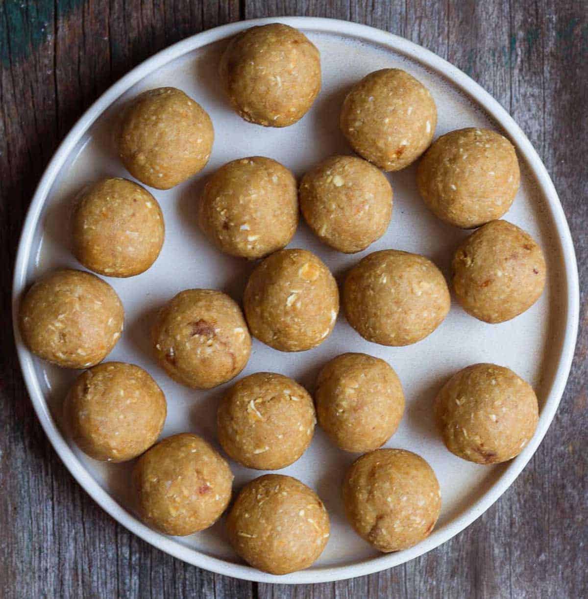 Rolled out dough balls on a round platter.
