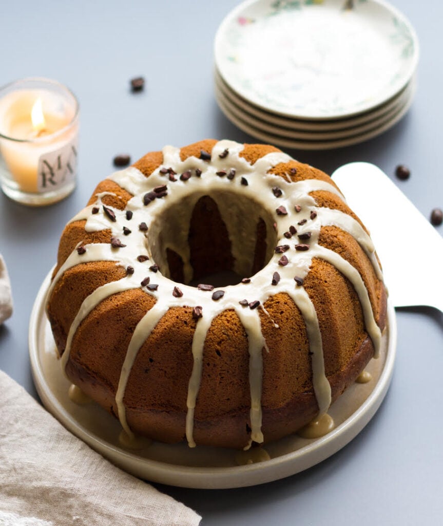 Espresso Bundt Cake on a serving platter with a cake server on the side.
