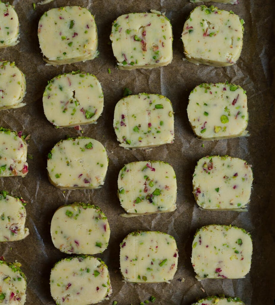 Sliced dough for baking Eggless Rose Pistachio Cookies | Easy Festive Cookies | Kesar pista biscuits