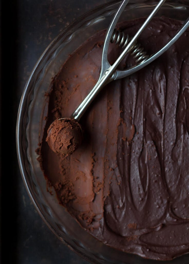 Scooping out ganache balls for Chai Spiced Chocolate Truffles | Easy Chocolate Truffles Recipe