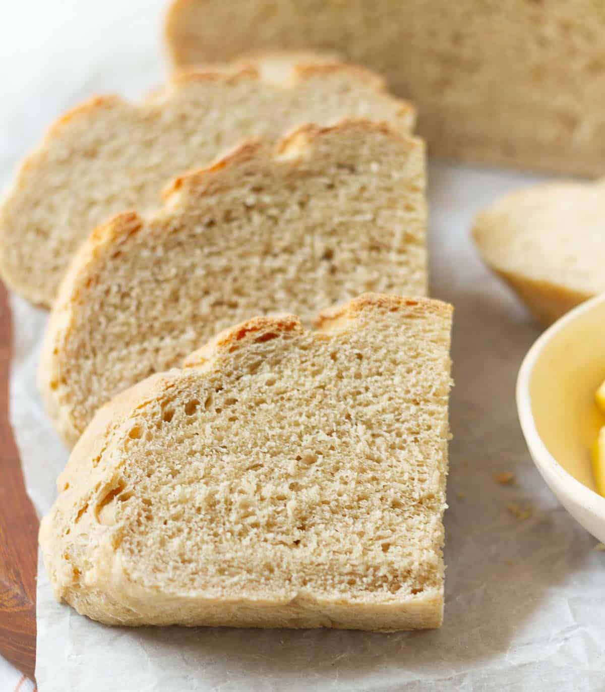 Sliced bread on parchment paper.