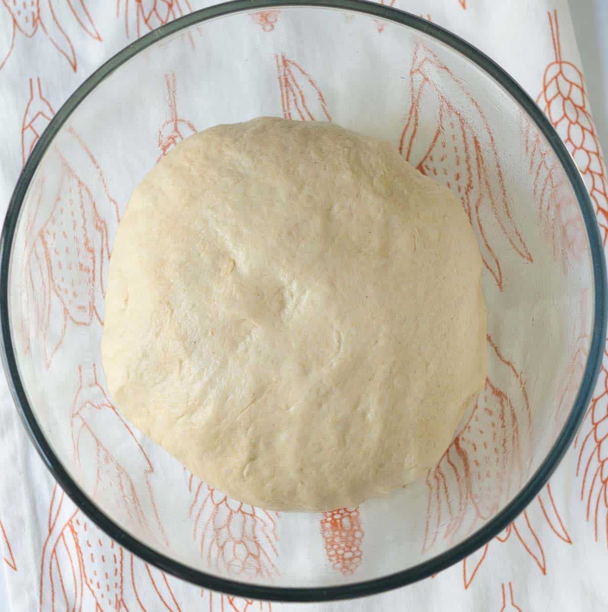 Kneaded dough for sourdough discard bread in a mixing bowl.