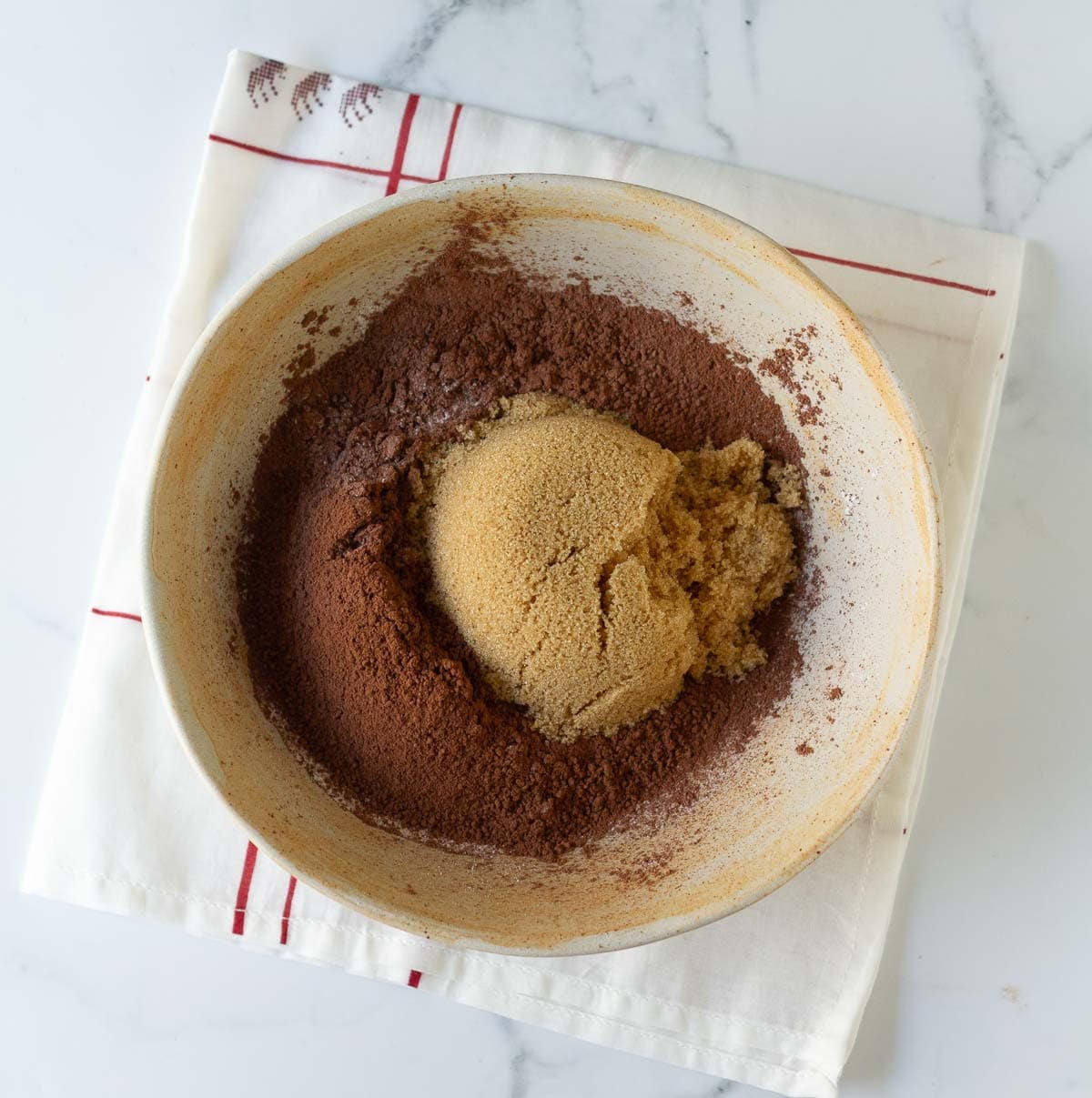 Dry ingredients for making chocolate lava cake in a bowl.