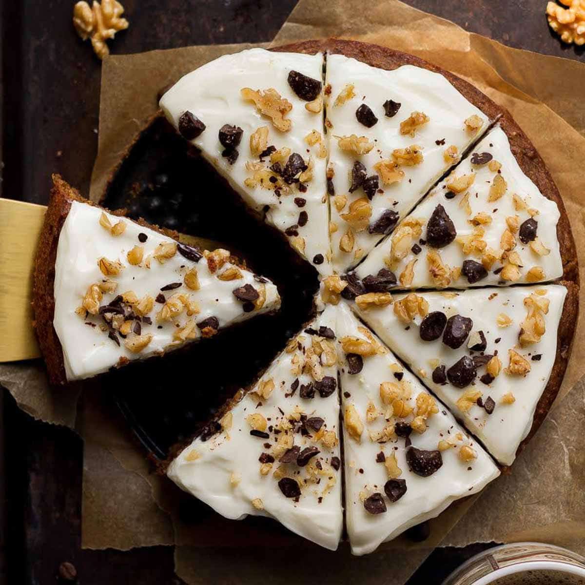 Sliced coffee banana cake on parchment paper.