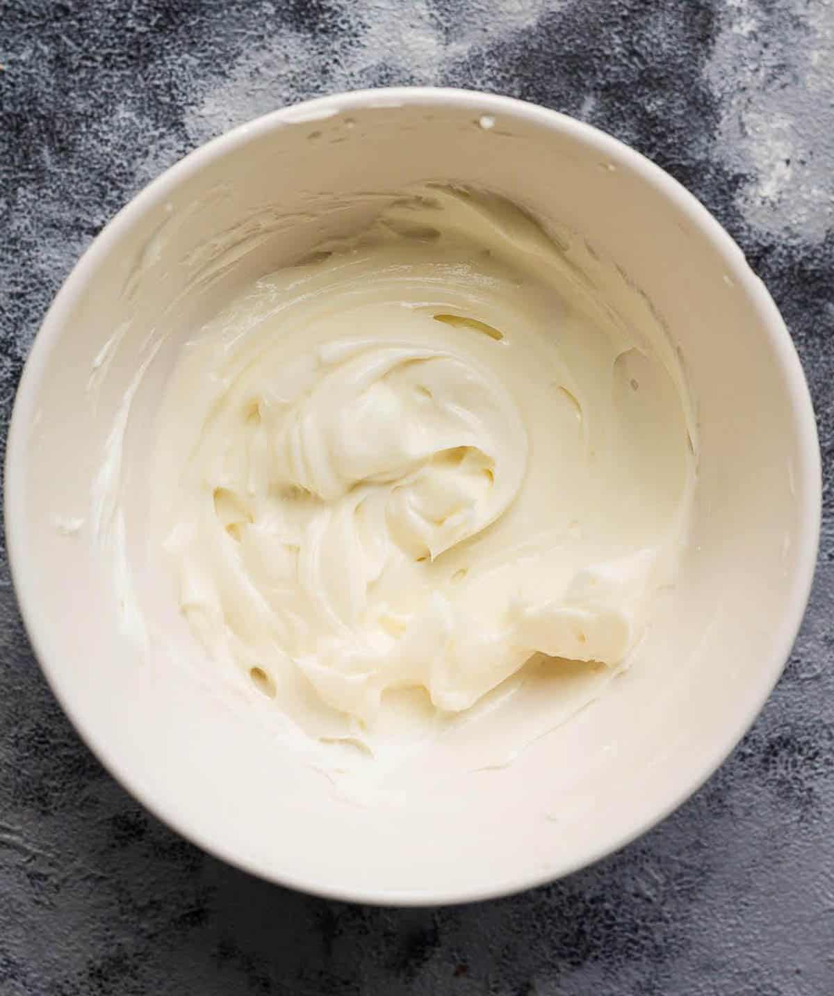 Mascarpone cheese frosting in a bowl.