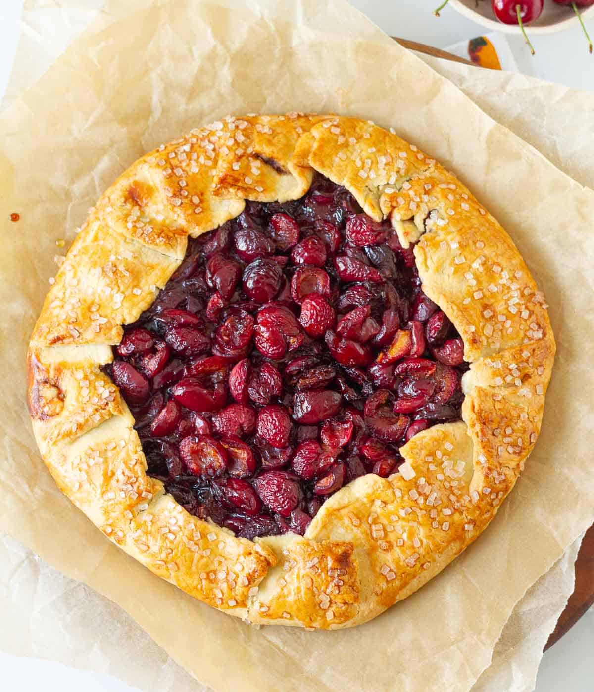 Rustic Cherry galette on parchment paper.
