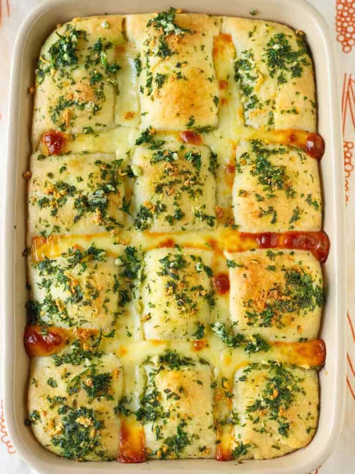 Baked garlic cheese bread in a baking dish.