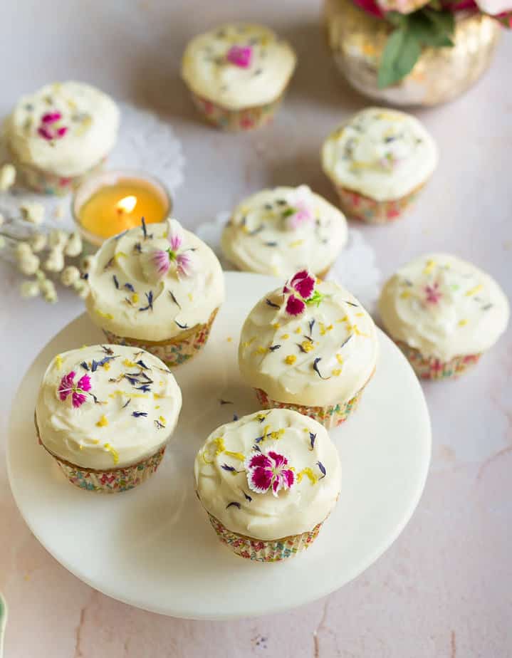 Lemon Poppyseed Cupcakes on a cake stand.