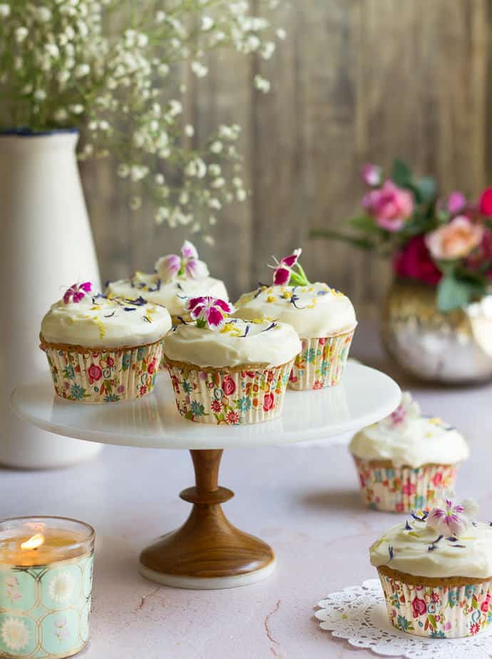 Lemon Poppyseed Cupcakes on a cake stand.