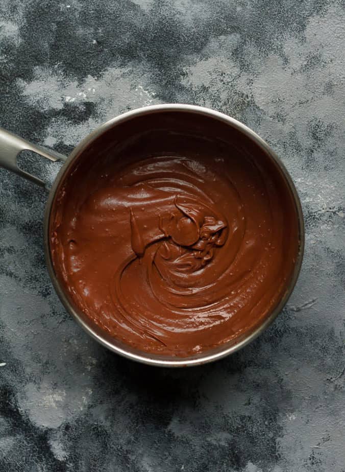 creamy chocolate peanut butter pudding in a saucepan