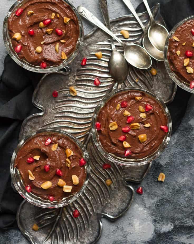 Ready to serve Chocolate Peanut Butter Pudding topped with chopped peanuts and pomegranate arils