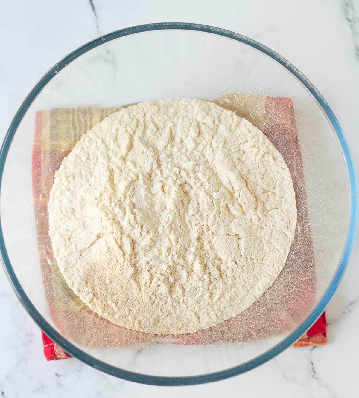 Dry ingredients for muffins in a mixing bowl.