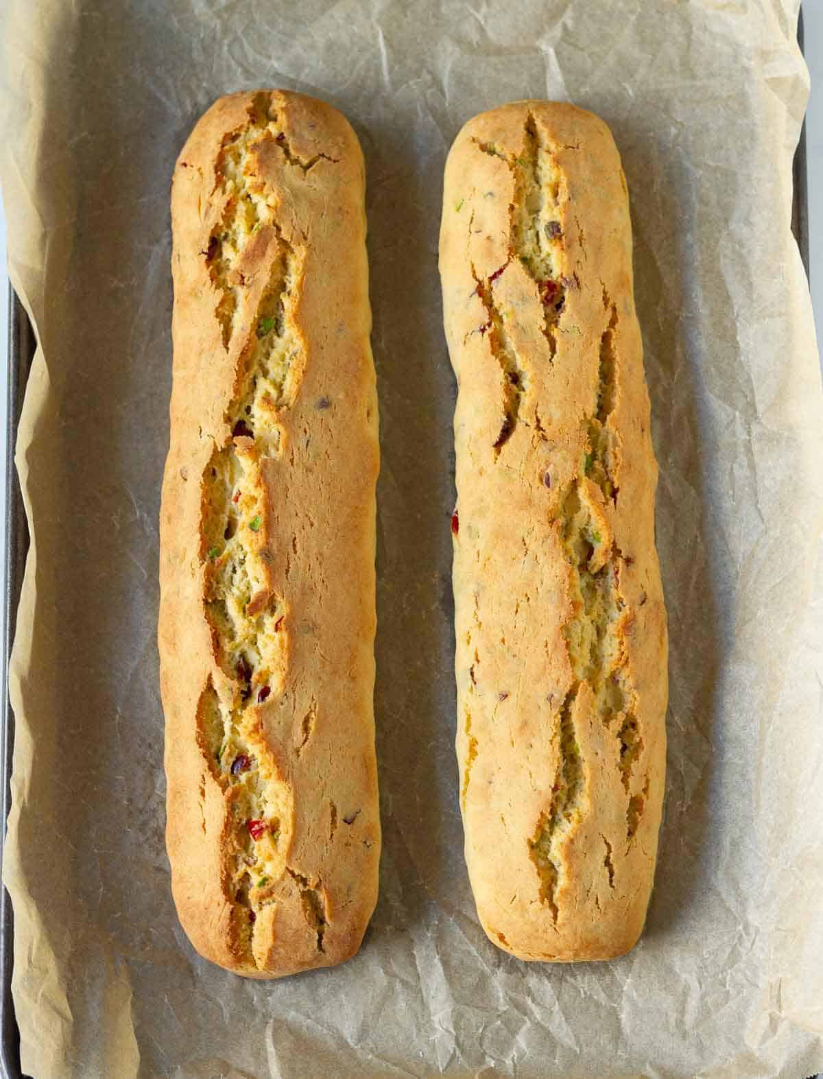 baked biscotti on a parchment-lined baking tray.