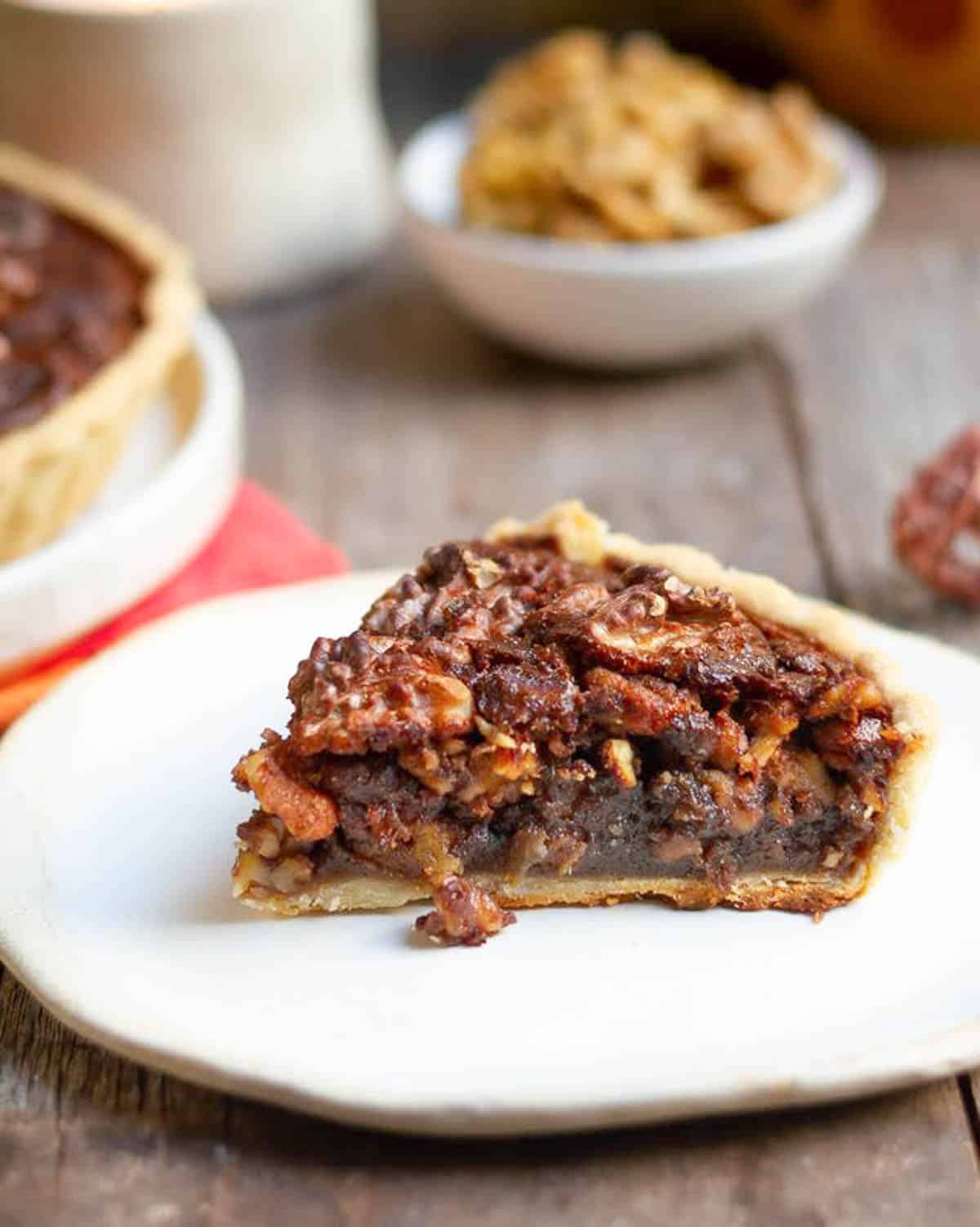 a slice of walnut pie on a small plate.