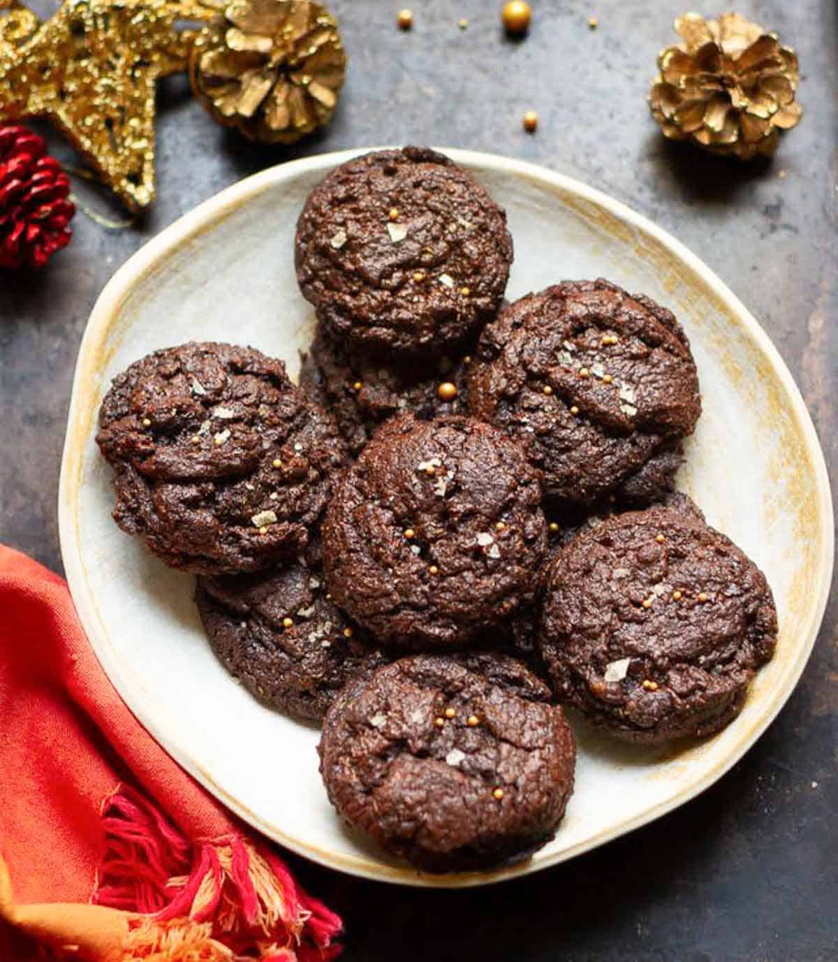 eggless brownie cookies on a platter with Christmas decorations around.