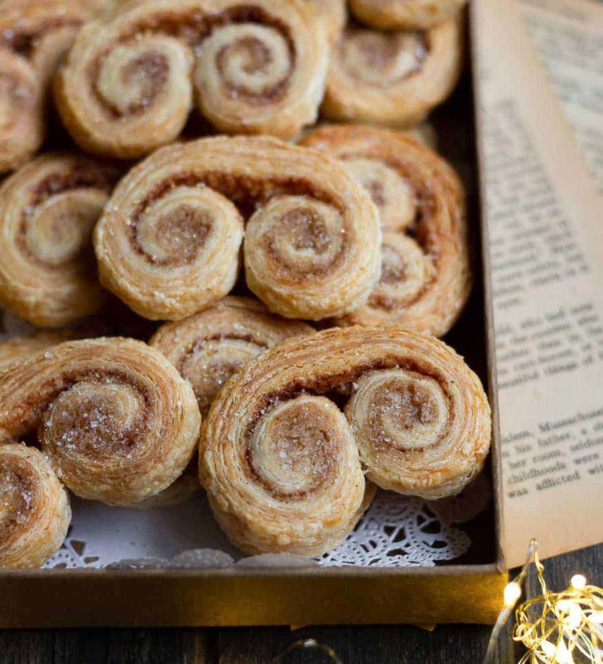 Cookies on a small tray on top of paper doily.