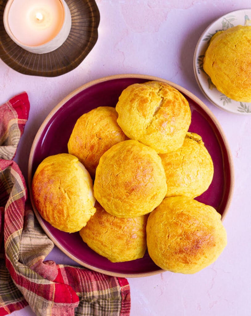 pineapple buns in a bowl with a checkered napkin around it.