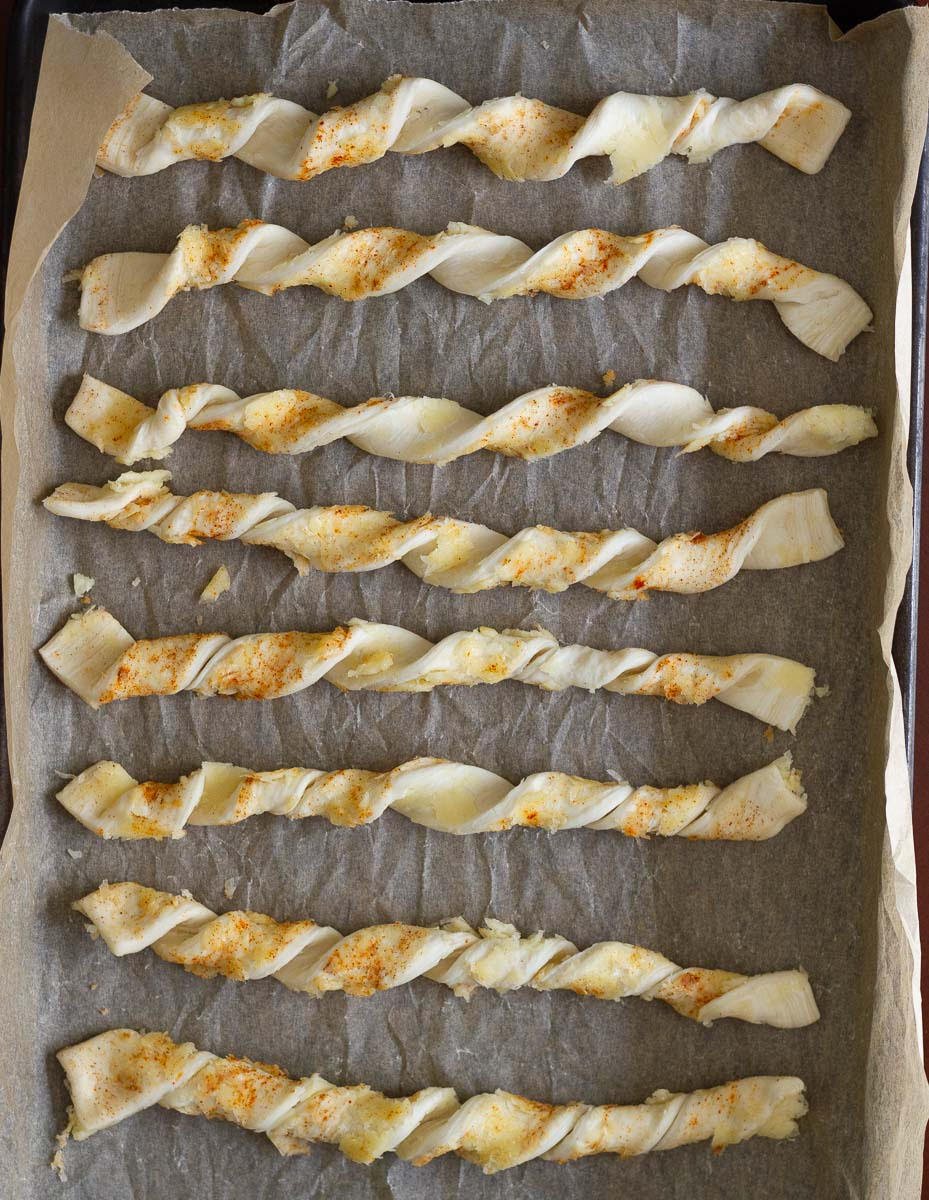 Twist each strip and place on the baking tray