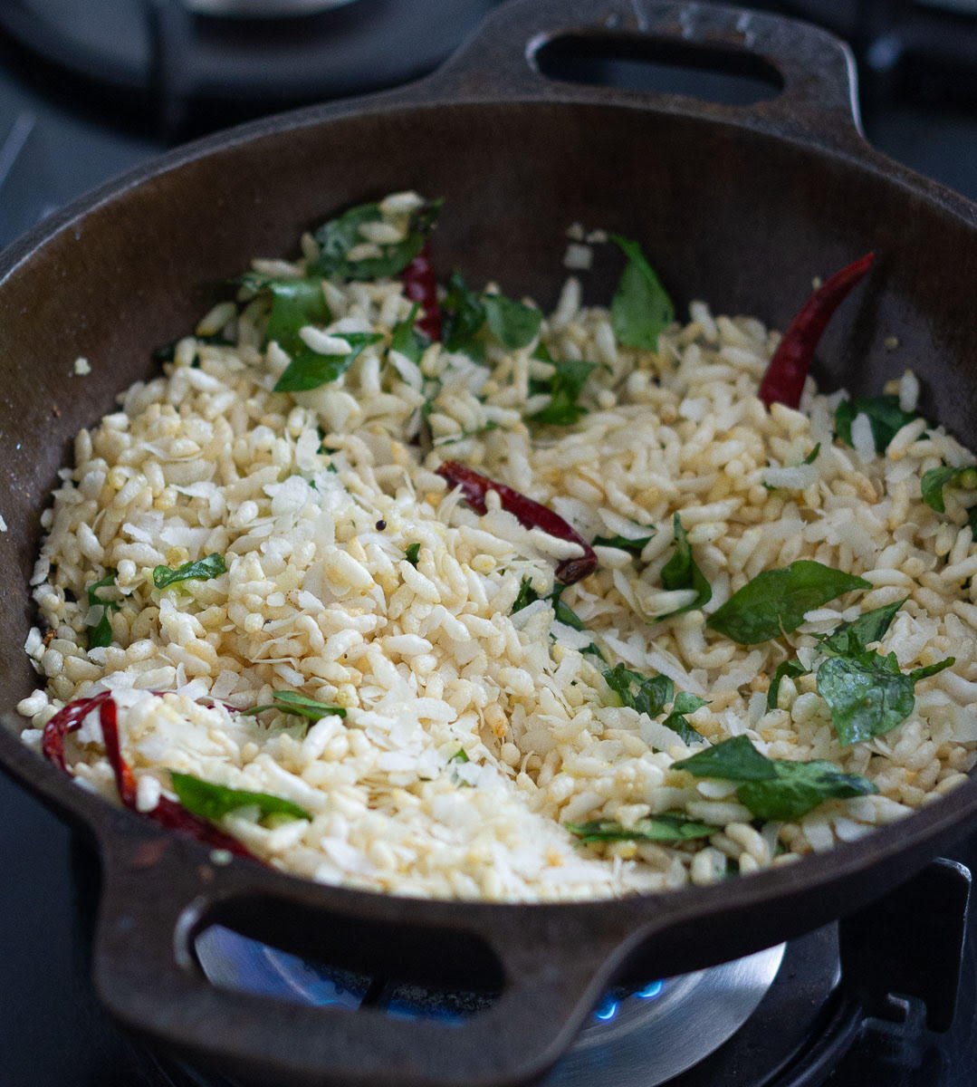 Add puffed rice and flattened rice to the mustard oil tempering