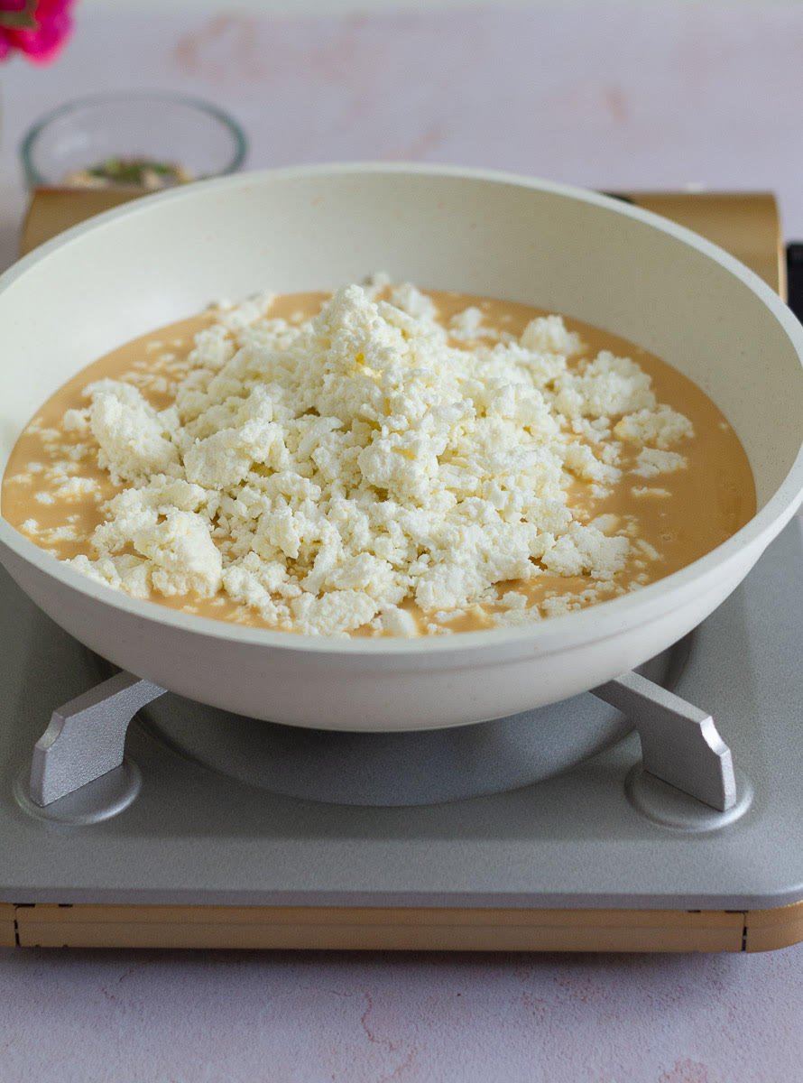 Cook condensed milk and crumbled paneer