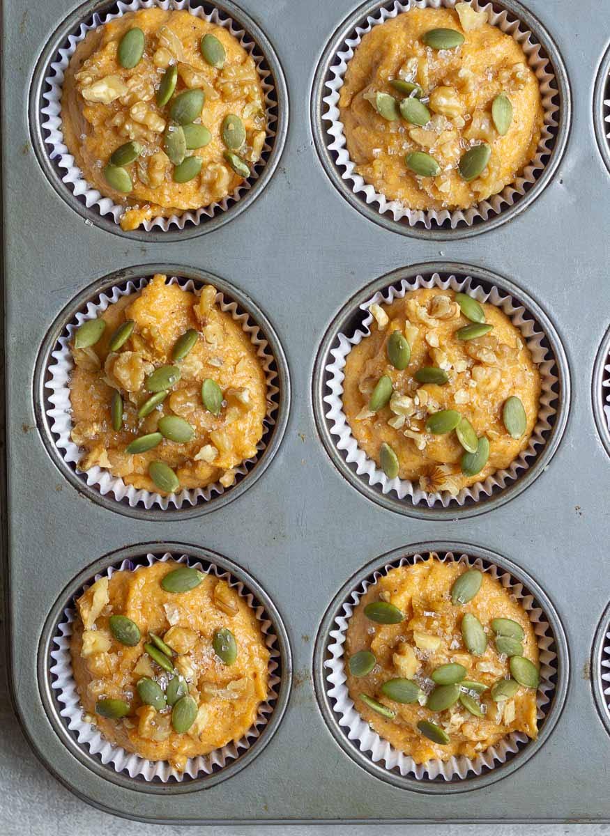 Top the batter with pumpkin seeds, walnuts and granulated sugar