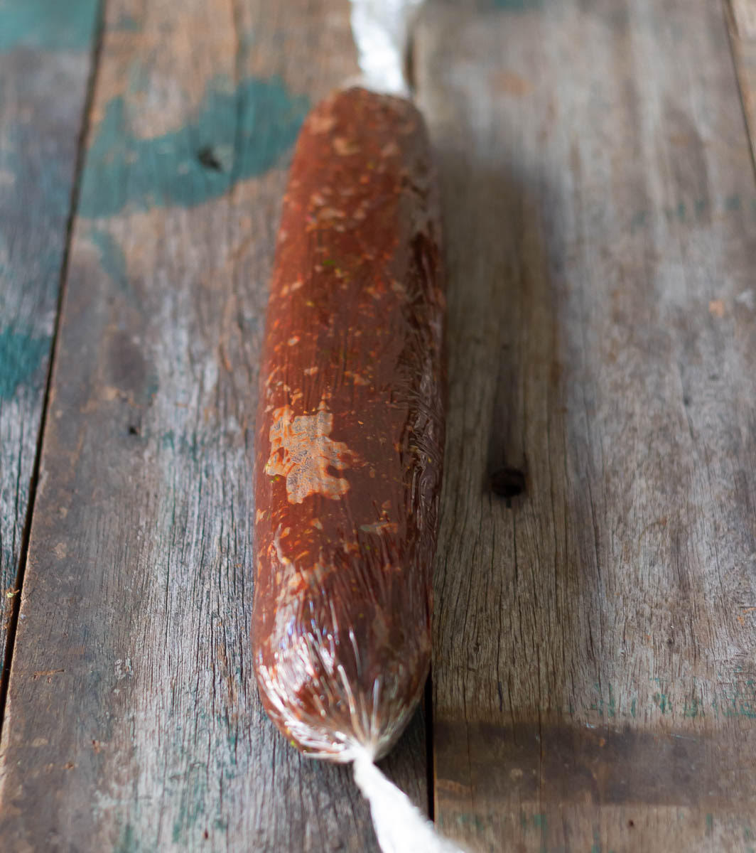 Roll up the chocolate biscuit mixture in a log and refrigerate