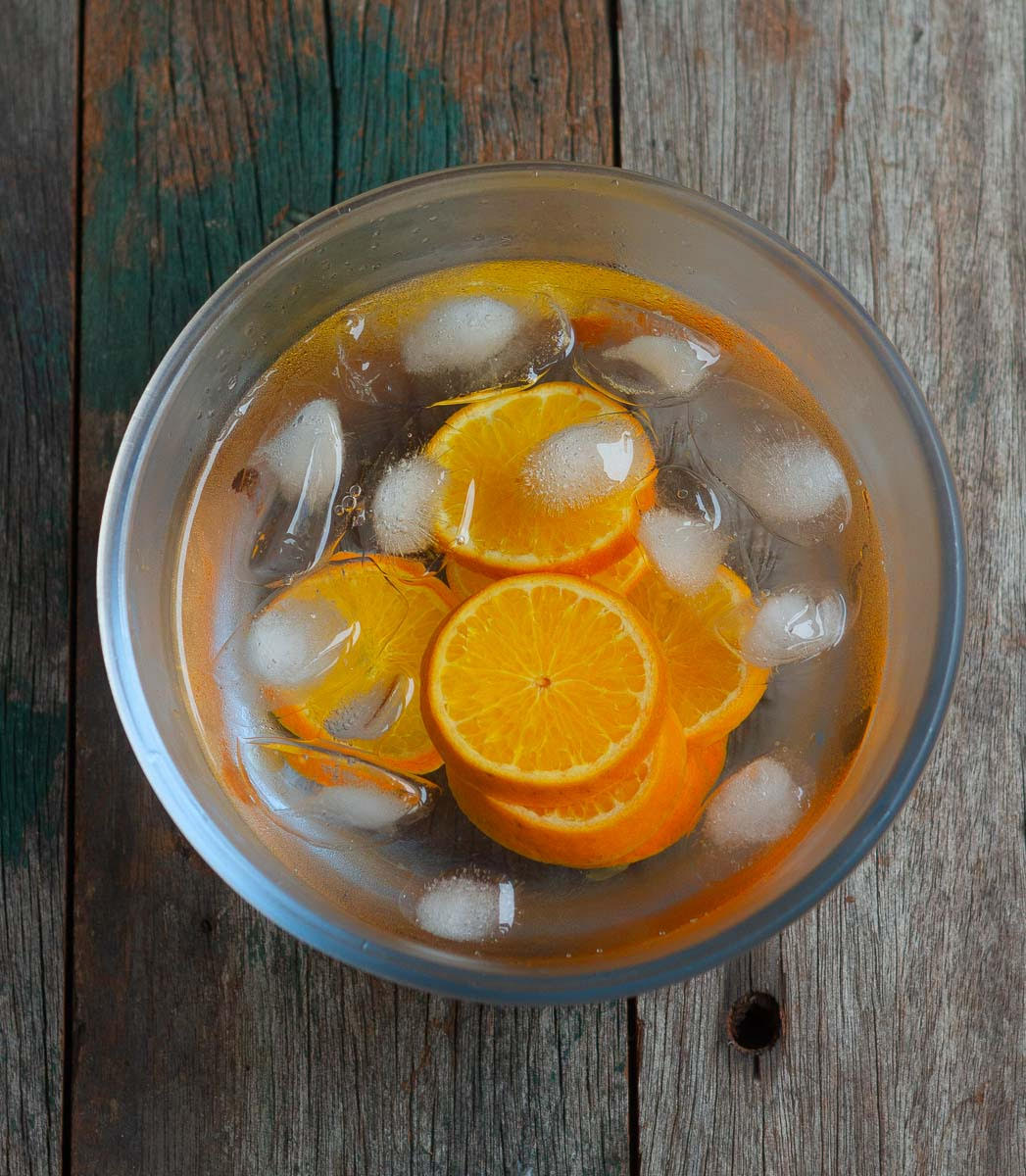 Place the blanched orange slices in iced water