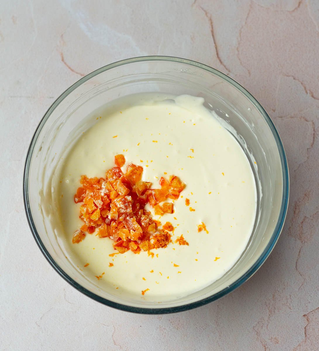 Fold in the candied oranges and orange zest into the batter