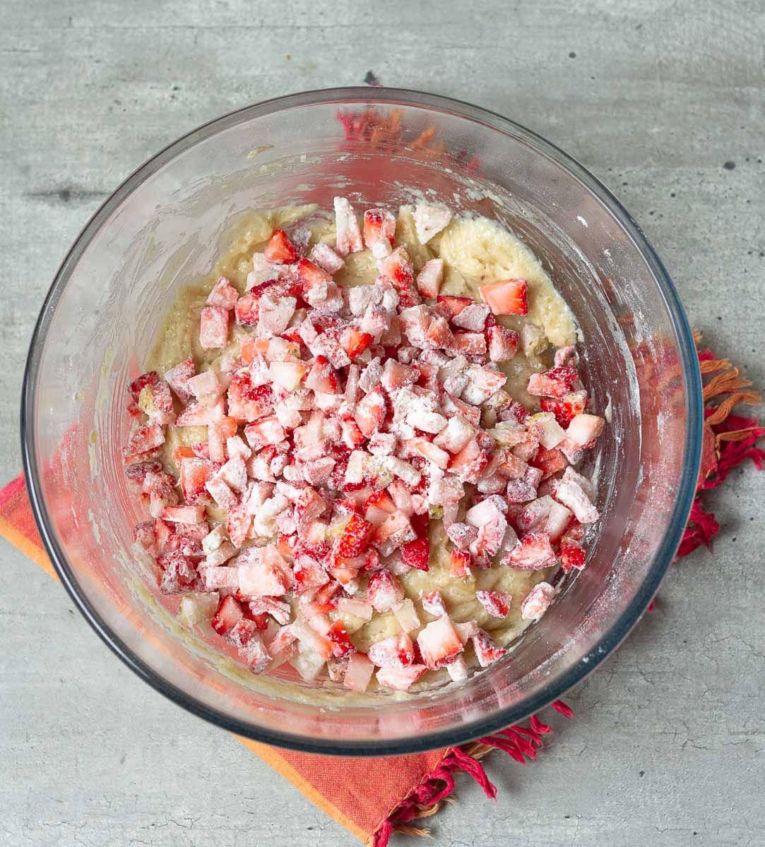 Fold in strawberries into the muffin batter