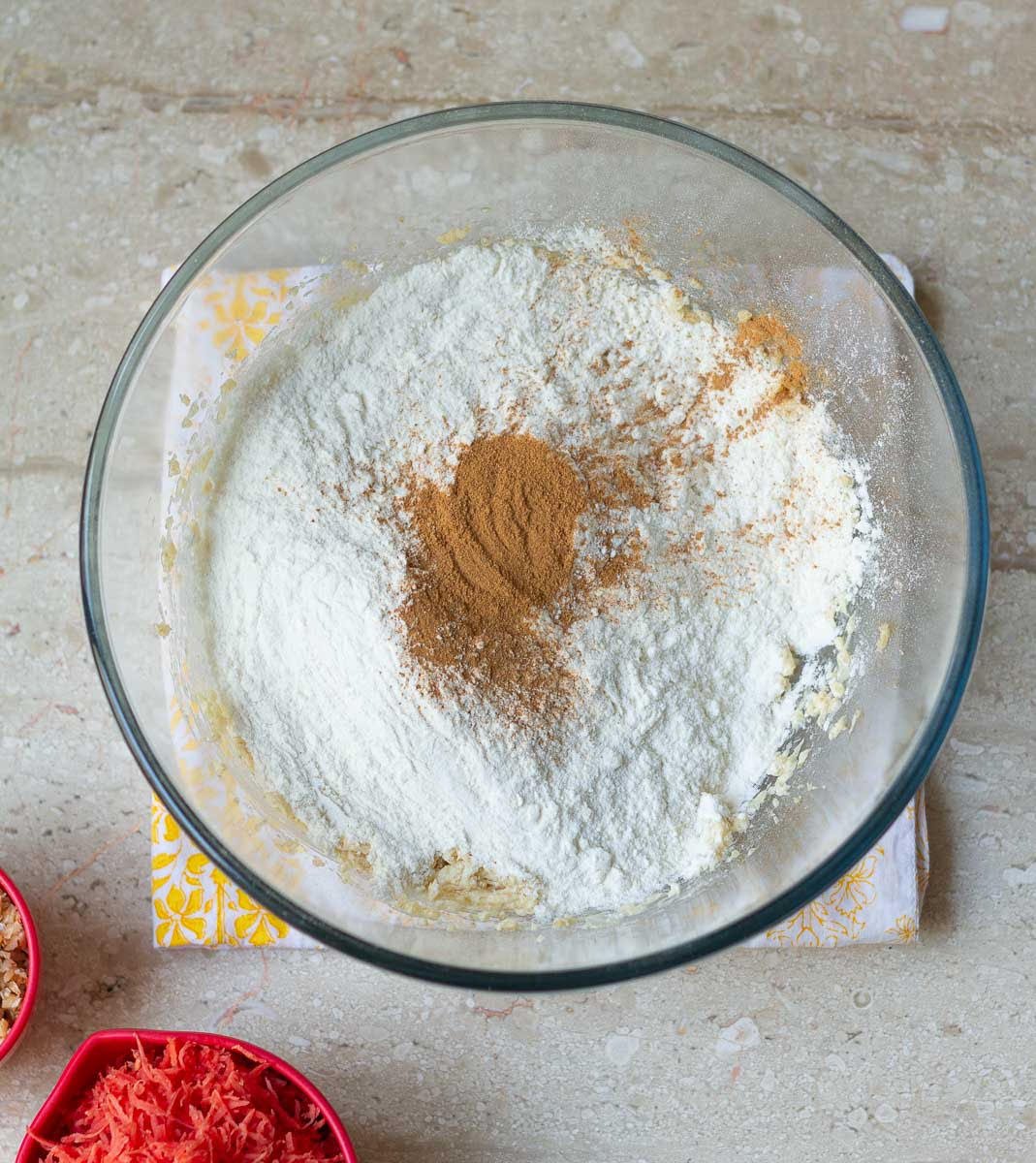 Flour, baking soda, and cinnamon powder added to the butter mixture