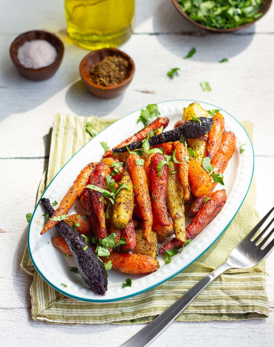 Easy Roasted Carrots In The Oven sprinkled with cilantro