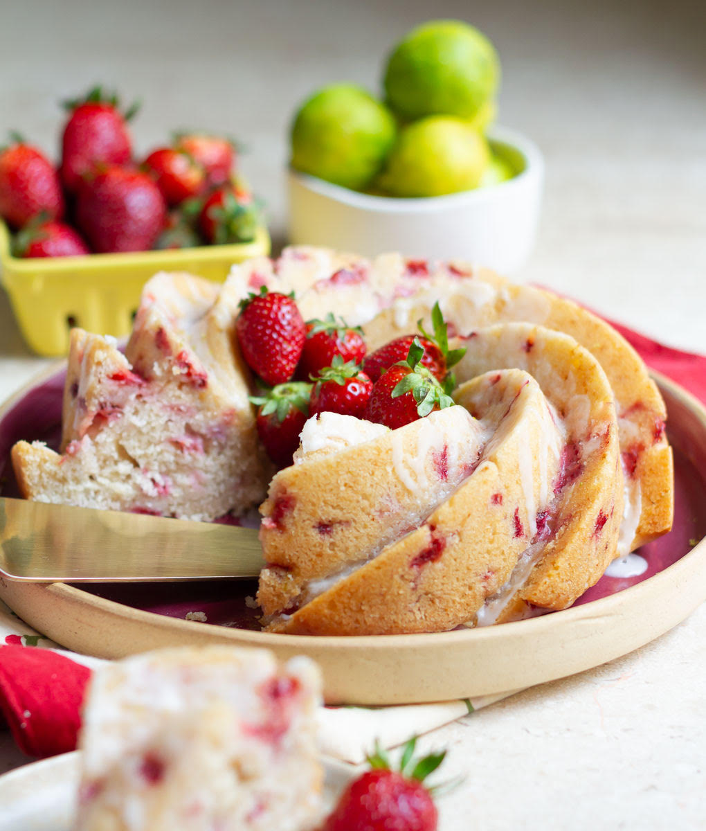 cross section of the Strawberry Lemon Bundt Cake on a red serving platter