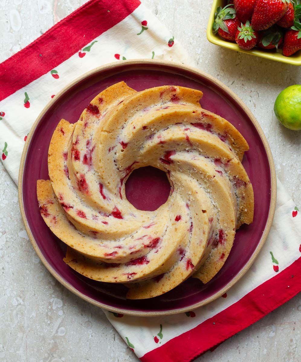 Strawberry Lemon Bundt Cake on a red serving platter