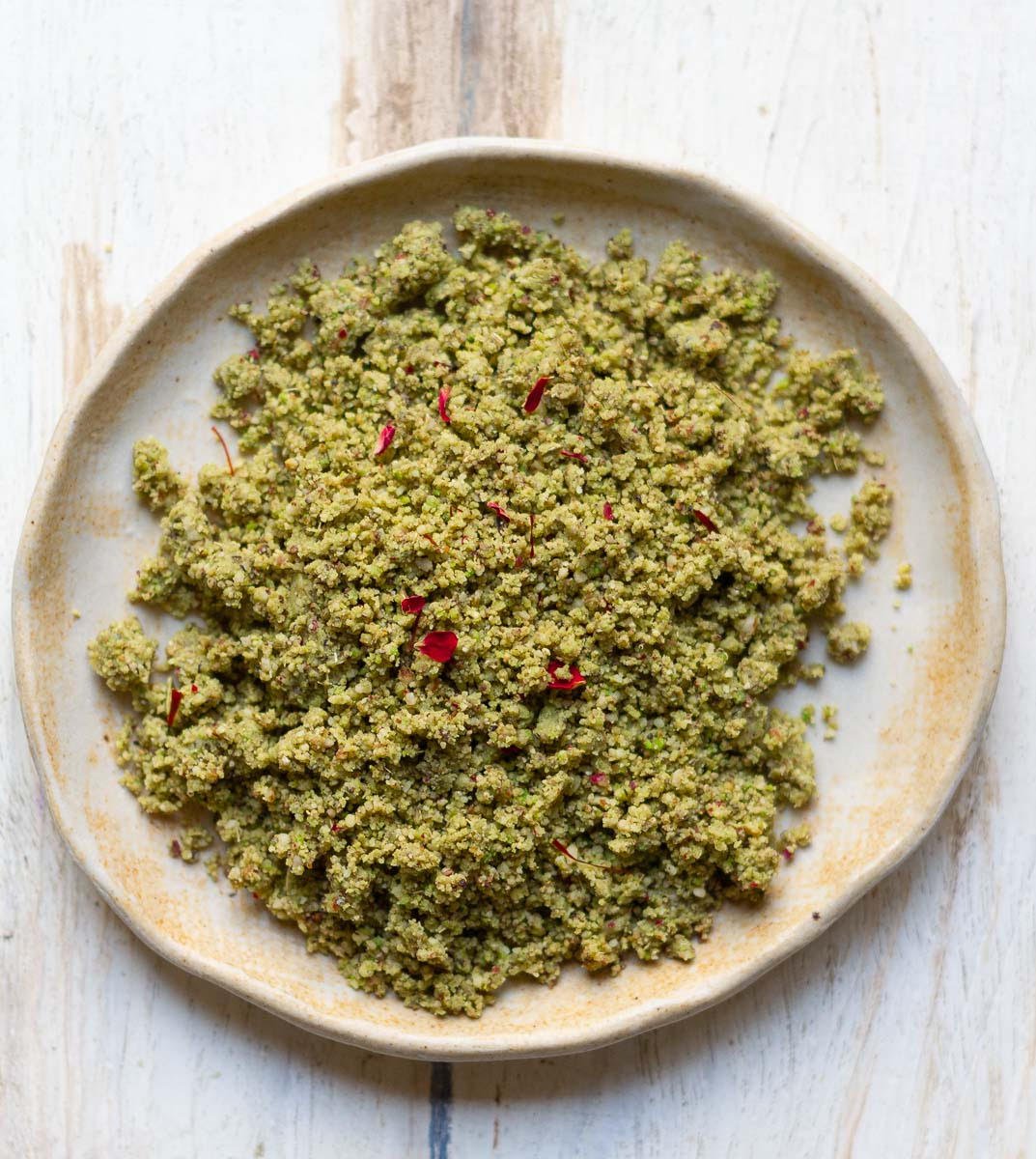 Thandai masala powder in a small plate